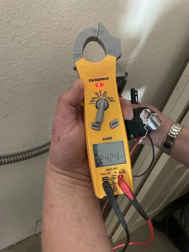 Voltage testing with clamp meter during Electrical Installation Services in Eastwood